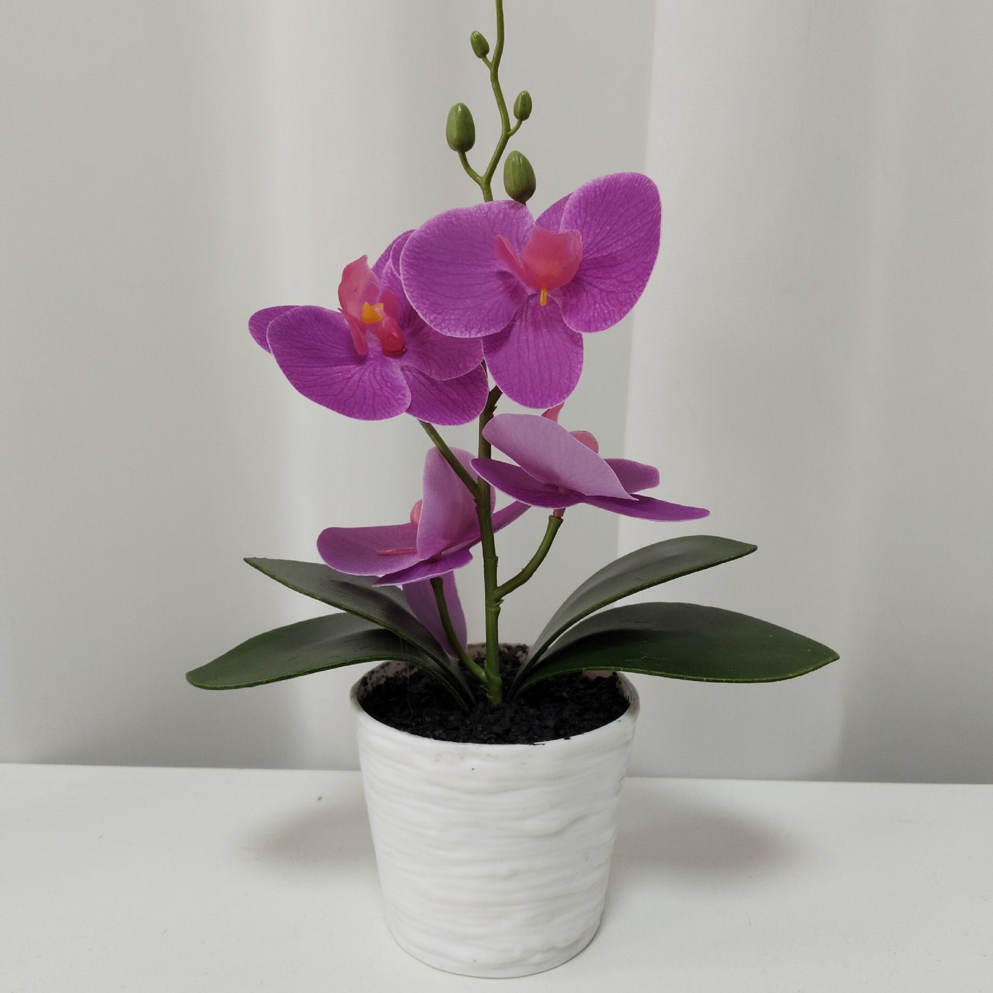 Simulated Phalaenopsis potted plants with seven flowers and four flowers, New Year's Eve flowers housewarming gifts, placed in the living room, light luxury home furnishing hotel